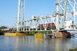 CP 8604 leads a westbound grain train across the Neches River Lift Bridge